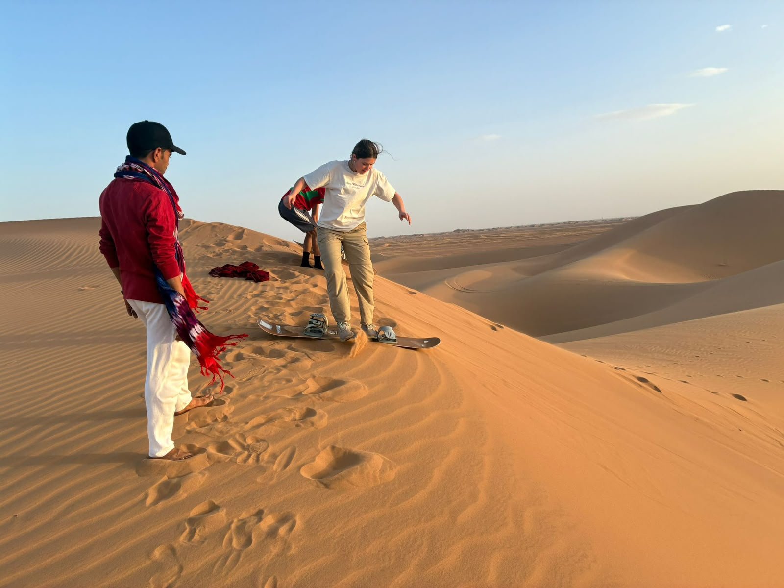 Travellers in the Moroccan desert on an Amasir Voyage trip
