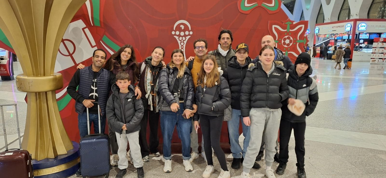 Two families with their Amasir Voyage guide at Marrakech airport