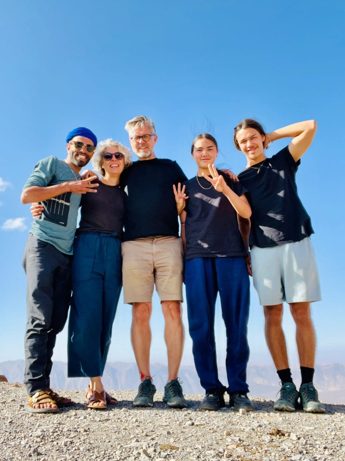 Family of four with their Amasir Voyage guide at a mountain viewpoint